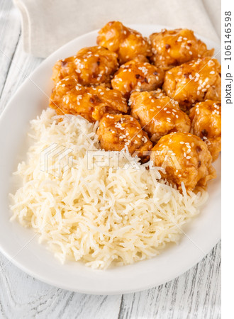Portion of orange chicken 106146598