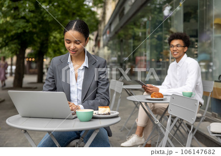 Colleagues working on project together and looking focused 106147682