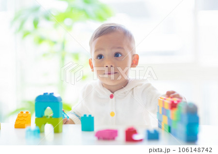 Baby boy playing with toy 106148742