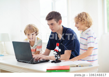 School kids with microscope. Science class. School kids with microscope. Science class. 106148817