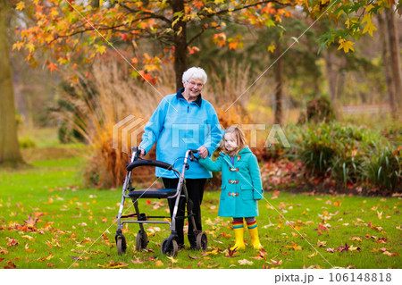 Senior lady with walker enjoying family visit Senior lady with walker enjoying family visit 106148818