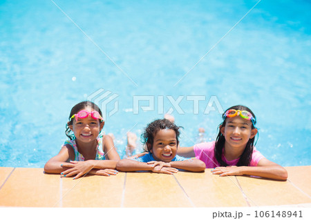 Kids in swimming pool. Children swim. Family fun. Kids in swimming pool. Children swim. Family fun. 106148941