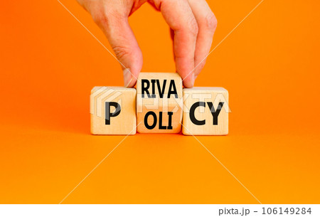 Privacy policy symbol. Concept words Privacy policy on wooden block on a beautiful orange table orange background. Businessman hand. Business and privacy policy concept. Copy space. 106149284