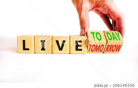Live today not tomorrow symbol. Businessman turns wooden cubes and changes word Live tomorrow to Live today. Beautiful white background. Business and live today not tomorrow concept. Copy space. 106149330