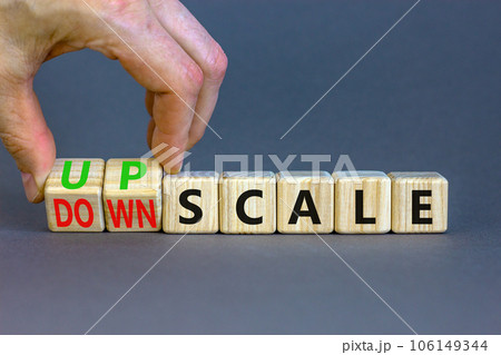 Upscale or downscale symbol. Concept words Upscale or Downscale on wooden cubes. Beautiful grey table grey background. Businessman hand. Business upscale or downscale concept. Copy space. Upscale or downscale symbol. Concept words Upscale or Downscale on wooden cubes. Beautiful grey table grey background. Businessman hand. Business upscale or downscale concept. Copy space. 106149344