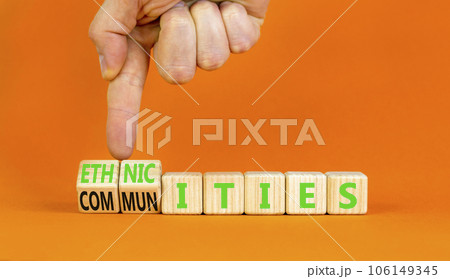 Ethnicities or communities symbol. Concept words Ethnicities and Communities on wooden cubes. Beautiful orange background. Businessman hand. Business ethnicities or communities concept. Copy space. Ethnicities or communities symbol. Concept words Ethnicities and Communities on wooden cubes. Beautiful orange background. Businessman hand. Business ethnicities or communities concept. Copy space. 106149345