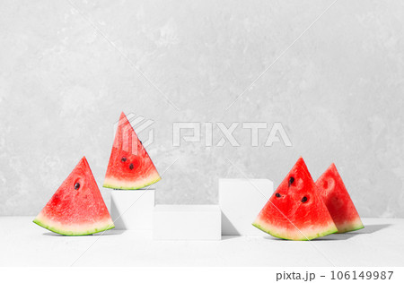 Summer cosmetics product presentation scene made with white podium and watermelon slices. Front view, studio photography. 106149987