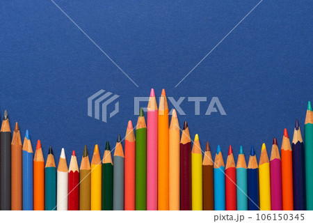 Colorful crayon on blue background Colorful crayon on blue background 106150345