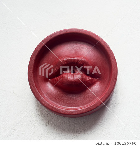 Incense stand red lips. Round shape on a white background. Esotericism, meditation 106150760