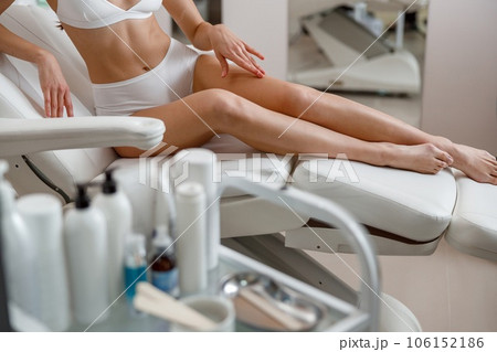 Cropped shot of body of woman ready for hair removal, skin treatment at spa beauty center Cropped shot of body of woman ready for hair removal, skin treatment at spa beauty center 106152186