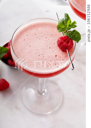 Raspberry martini cocktail with vodka, juice and raspberry liqueur Raspberry martini cocktail with vodka, juice and raspberry liqueur 106152986
