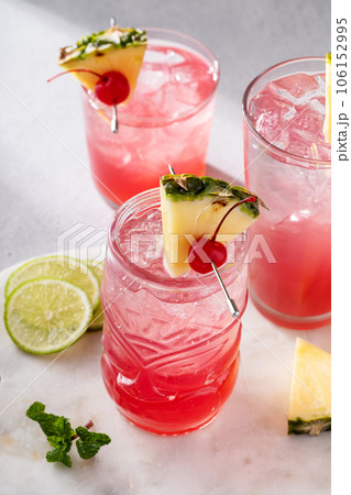 Singapore sling cocktail in variety of glasses 106152995