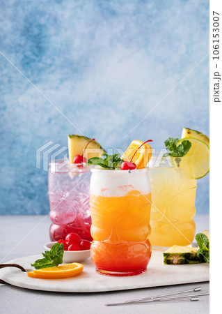 Zombie tropical cocktail with rum in tiki glasses 106153007