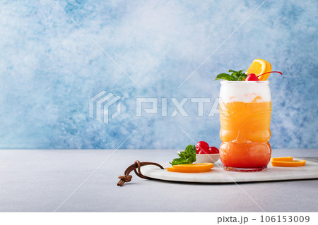 Zombie tropical cocktail with rum in tiki glasses 106153009