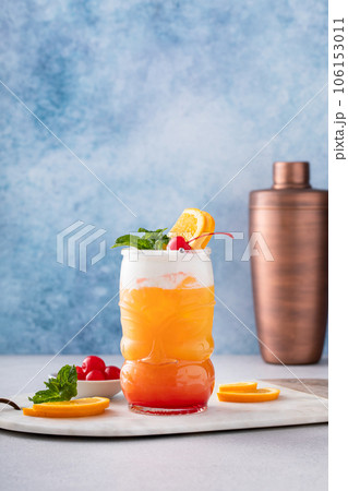 Zombie tropical cocktail with rum in tiki glasses 106153011