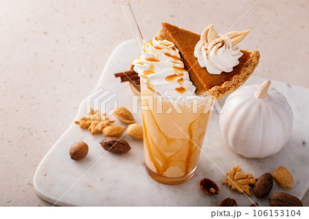 Pumpkin pie milkshake with caramel syrup and whipped cream Pumpkin pie milkshake with caramel syrup and whipped cream 106153104