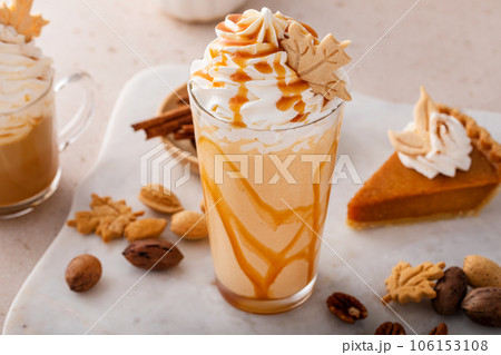 Pumpkin pie milkshake with caramel syrup and whipped cream 106153108