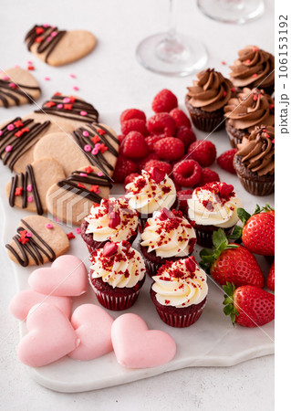 Valentines day charcuterie board with cupcakes and strawberries Valentines day charcuterie board with cupcakes and strawberries 106153192