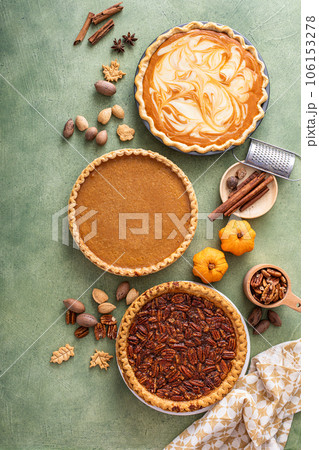 Traditional fall Thanksgiving pies, pumpkin and pecan pie 106153278