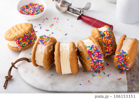 Ice cream sandwiches with vanilla ice cream and peanut butter cookies Ice cream sandwiches with vanilla ice cream and peanut butter cookies 106153351