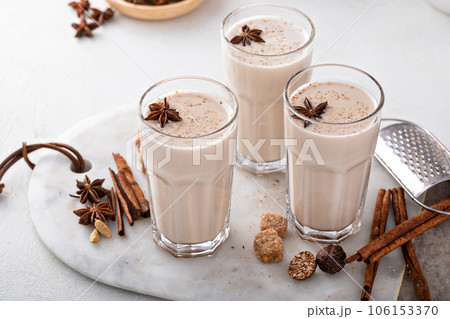 Chai in tall glasses with whole spices 106153370