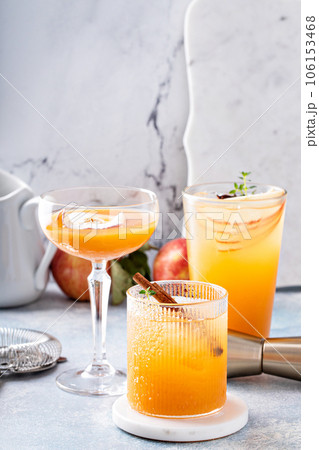 Variety of fall cocktails or mocktails made with apple cider Variety of fall cocktails or mocktails made with apple cider 106153468