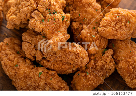 Fried chicken tenders or strips with sauces and fries 106153477