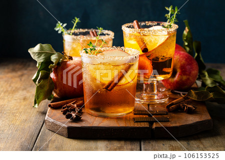 Apple cider margarita with brown sugar rim and cinnamon stick 106153525