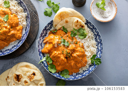 Chicken tikka masala, cooked marinated chicken in spiced curry sauce 106153583