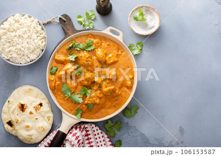 Chicken tikka masala, cooked marinated chicken in spiced curry sauce Chicken tikka masala, cooked marinated chicken in spiced curry sauce 106153587
