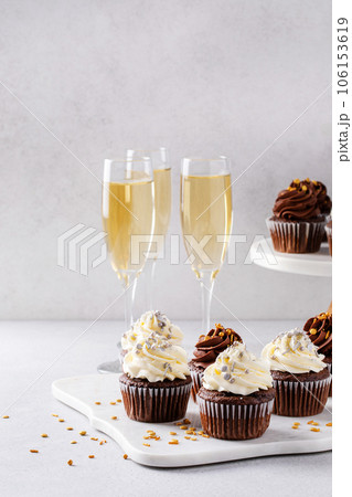 Festive cupcakes with sprinkles served for New Years Eve party 106153619