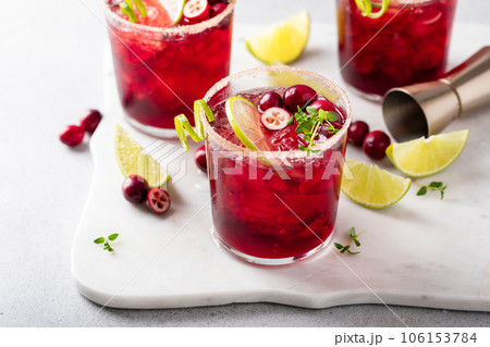 Cranberry and lime margarita cocktail or mocktail 106153784