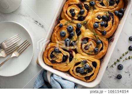 Summer breakfast idea, blueberry cinnamon rolls in a baking dish 106154854