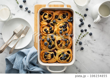 Summer breakfast idea, blueberry cinnamon rolls in a baking dish 106154855