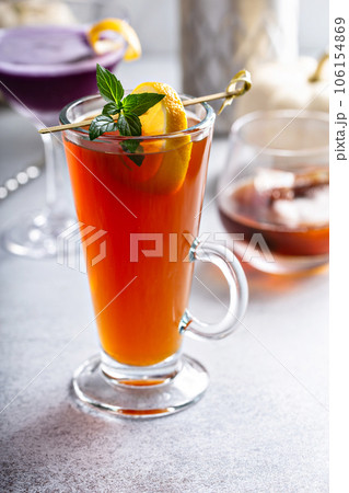 Hot fall cocktail, hot apple toddy with lemon in a glass 106154869