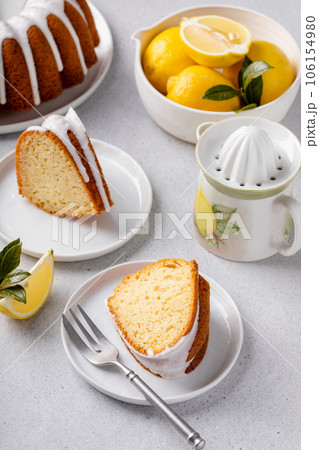 Lemon bundt cake drizzled with powdered sugar glaze Lemon bundt cake drizzled with powdered sugar glaze 106154980