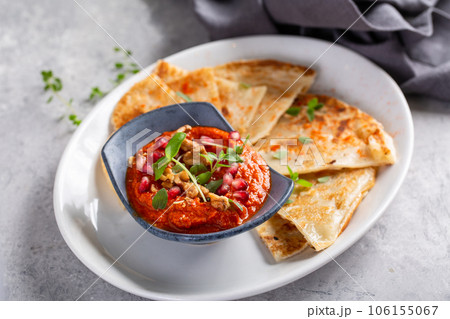 Flatbread served with spicy dipping sauce Flatbread served with spicy dipping sauce 106155067