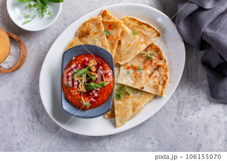 Muhammara, roasted bell pepper spread, served with roti Muhammara, roasted bell pepper spread, served with roti 106155070