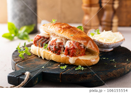 Meatball sub sandwich with marinara and mozzarella 106155554