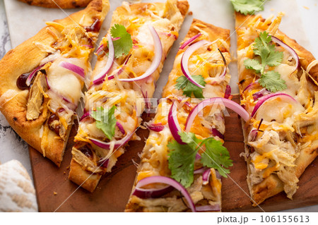 Barbeque chicken flatbread with cheese and red onion 106155613
