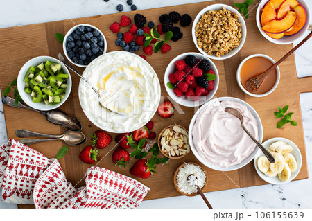 Yogurt bowl bar, big board with different toppings 106155639