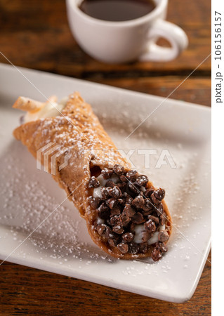 Traditional italian desserts cannoli on the plate Traditional italian desserts cannoli on the plate 106156157