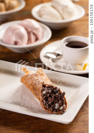 Traditional italian desserts cannoli on the plate Traditional italian desserts cannoli on the plate 106156159