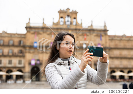 Woman tourist with phone, Salamanca, Spain 106156224