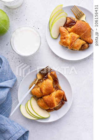 Apple dumplings in flaky pastry with caramel sauce 106156431