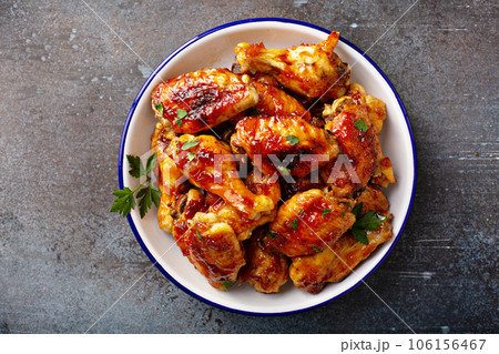 Hot sauce glazed chicken wings, roasted or fried 106156467