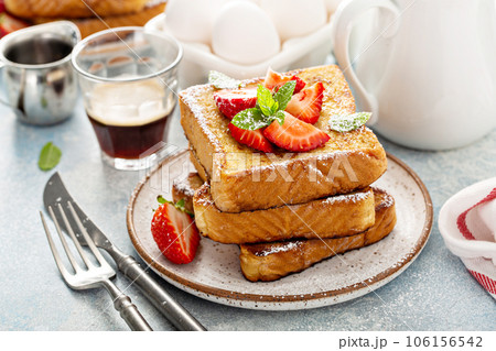 French toasts with strawberry and powdered sugar 106156542