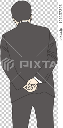 A man in a suit with his hands behind his back 106157298