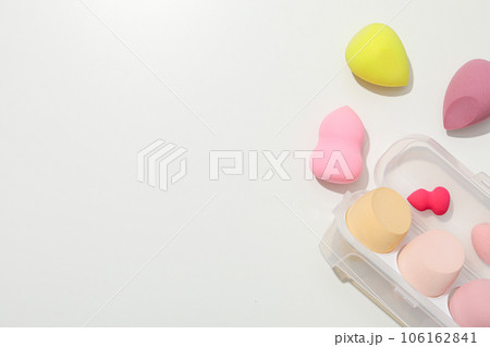Cosmetic sponges in case on white background, space for text 106162841