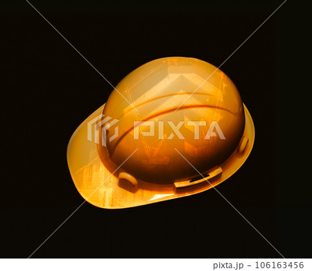 Safety helmet on dark background, Yellow helmet for labourers 106163456